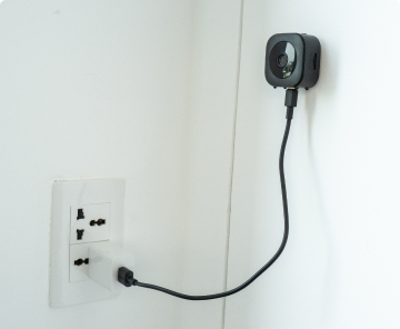 GuardHouse compact wireless camera on a table. Official product photograph.